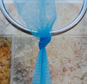 Tie the Soap Saver in place in the shower.